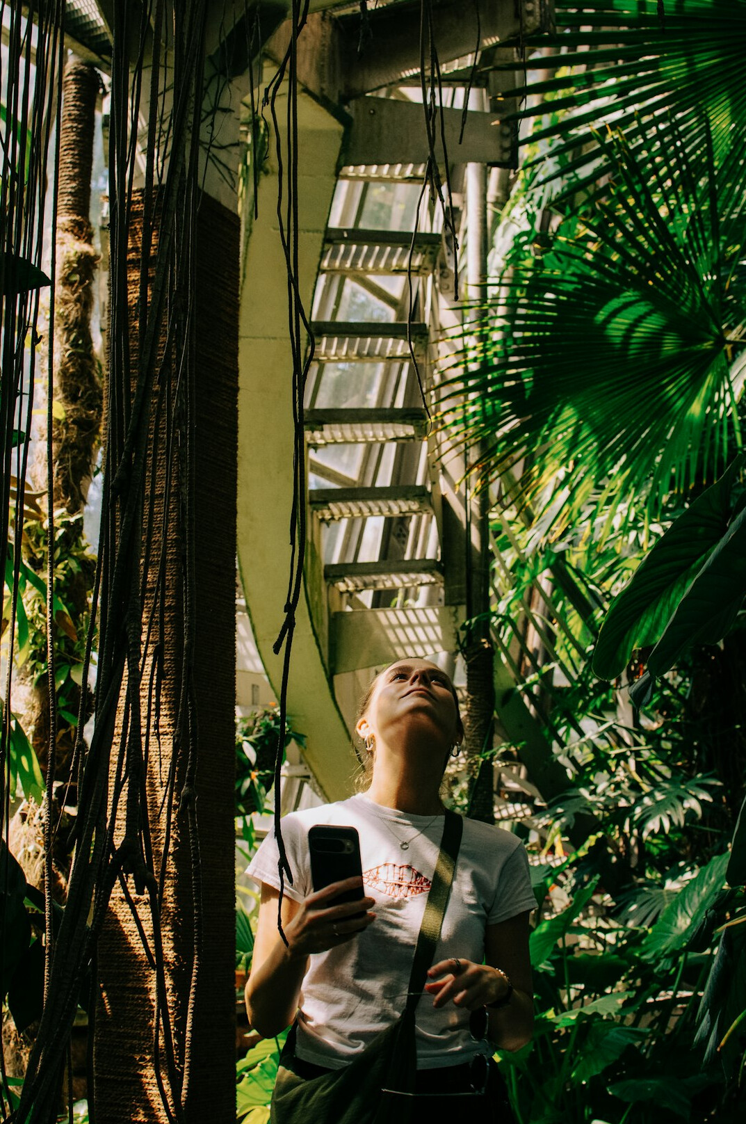 person reading book in garden