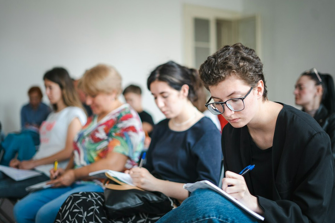 group of teenagers studying