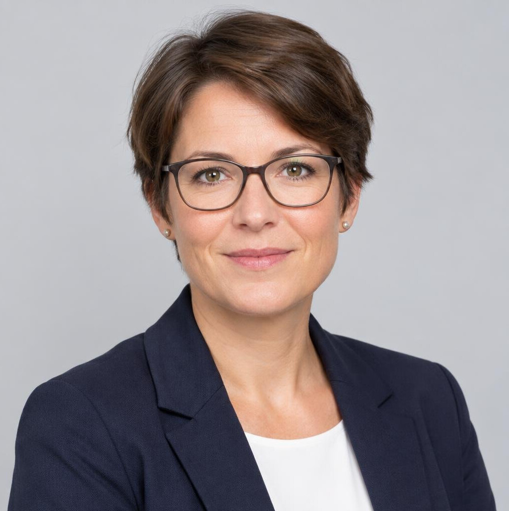Studio portrait of a woman researcher wearing glasses
